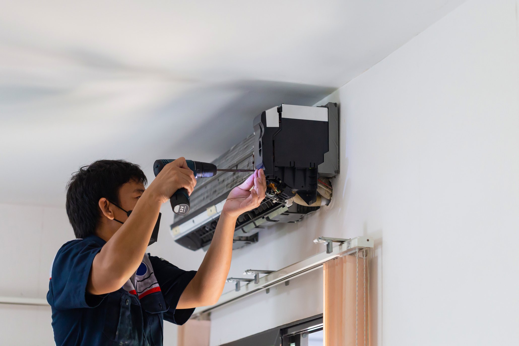 Air Conditioning Repair, Repairman Fixing Air Conditioning Syste